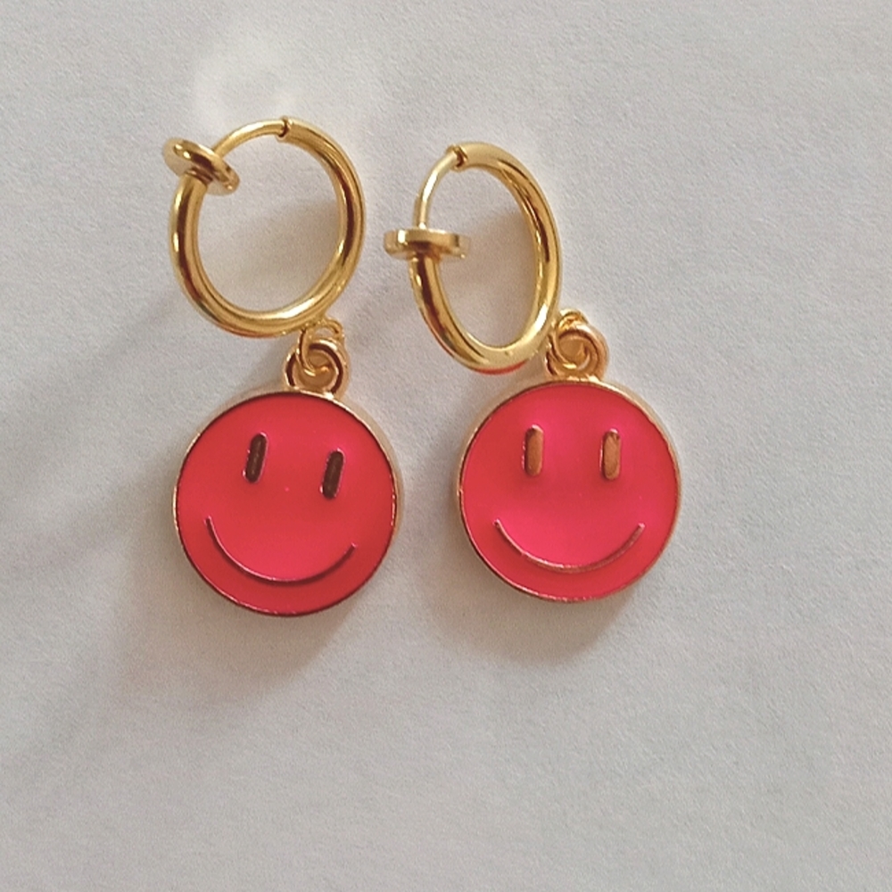 Smiley clip on earrings. Smiling face, hot pink